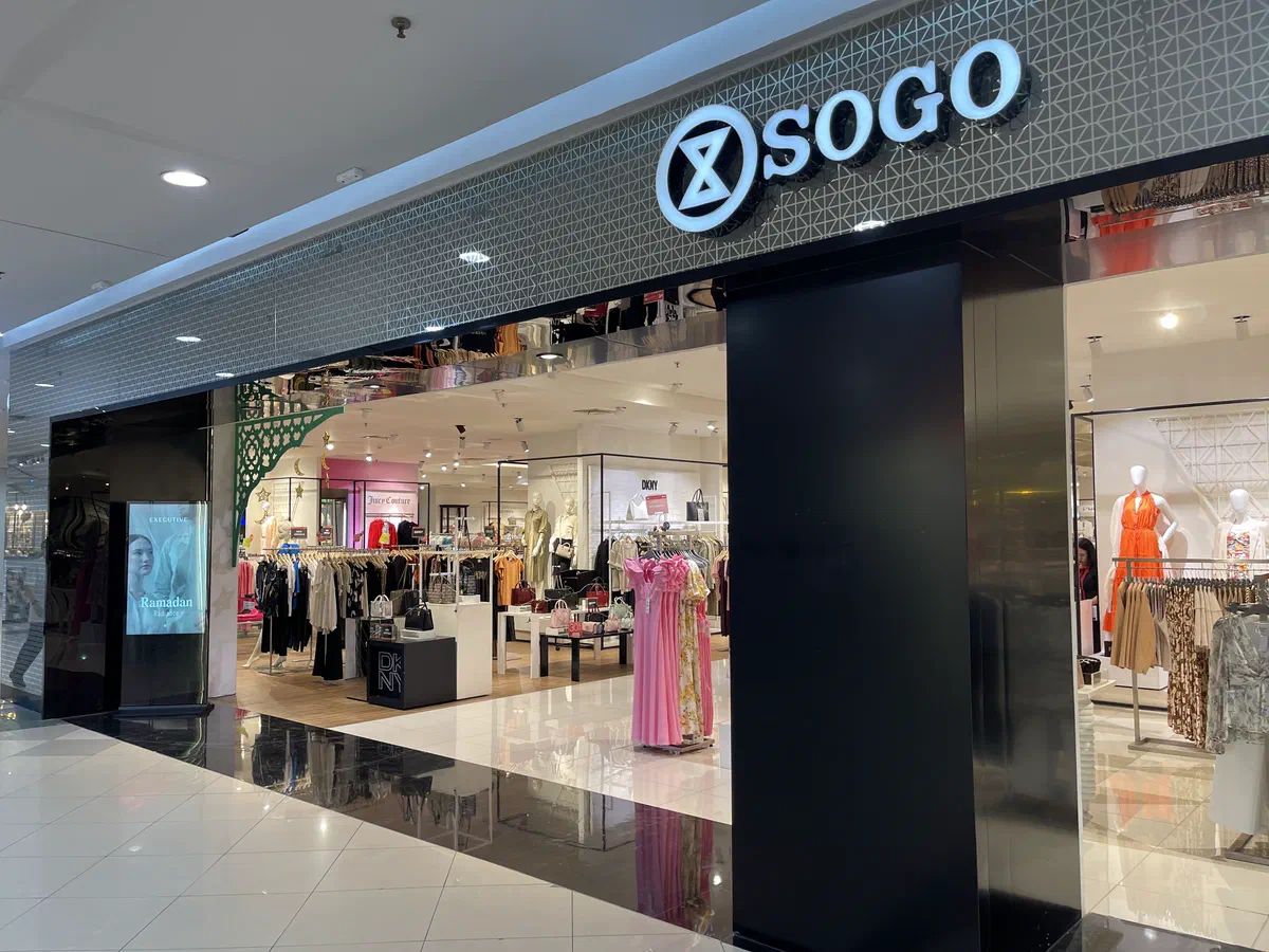 Digital standee at a department store entrance showing a Ramadan fashion campaign